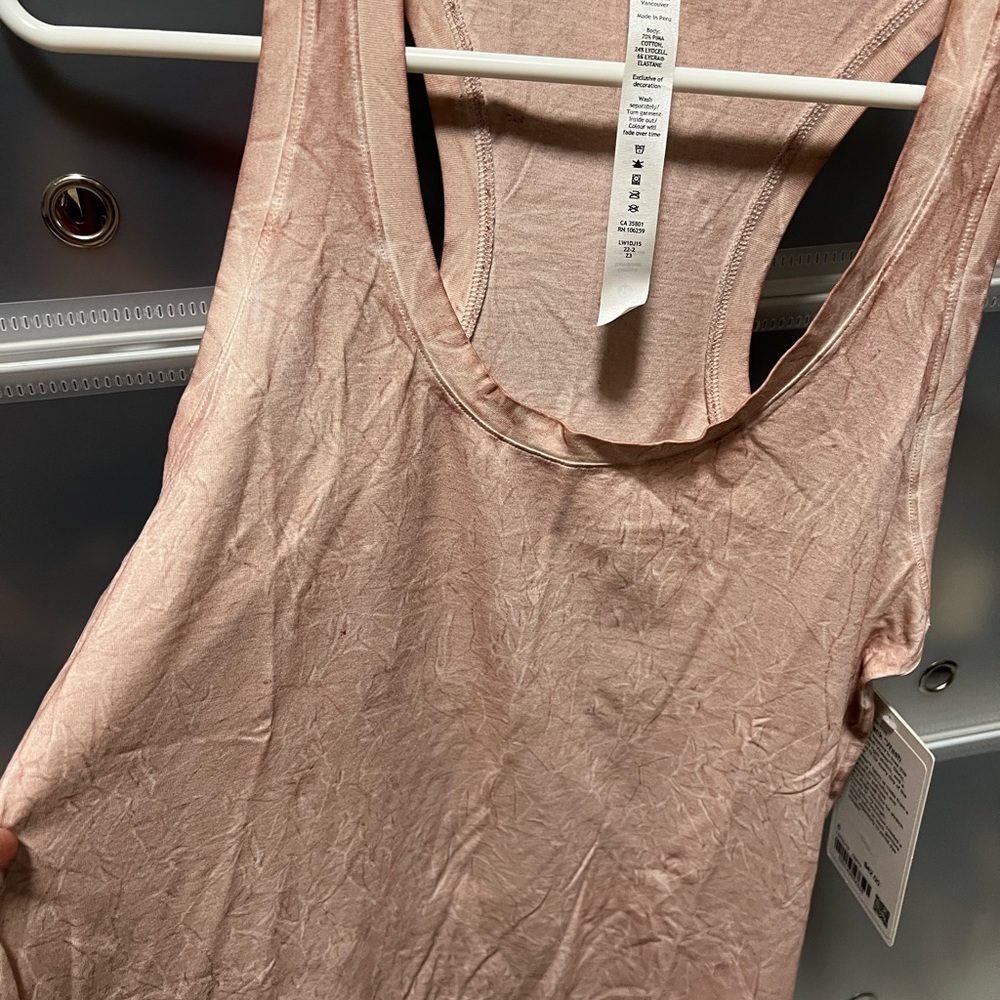 Brand New. Sleeveless coral Lululemon shirt
